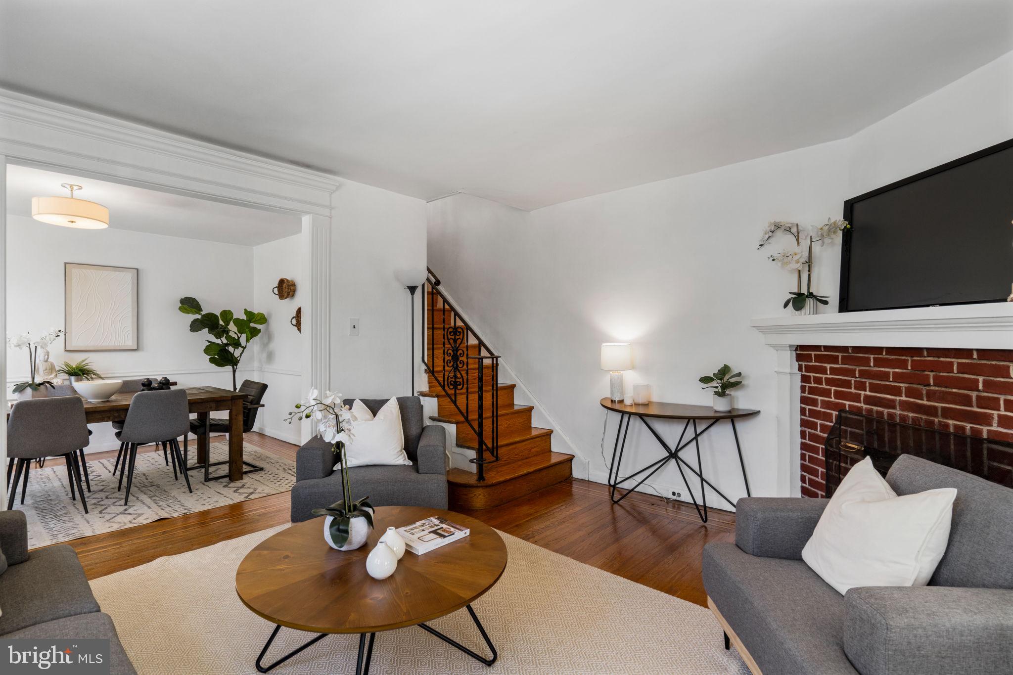 264 Pancoast Avenue Springfield, PA 19064 - Photo 10 of 38 a living room with furniture kitchen view and a fireplace