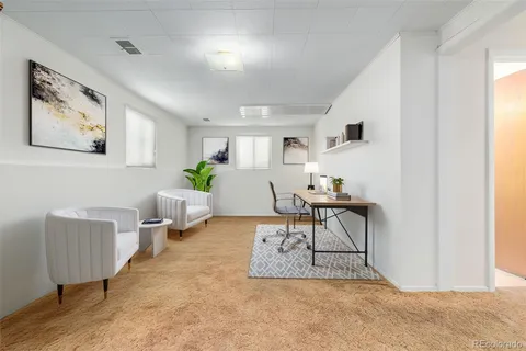 a living room with furniture and a table