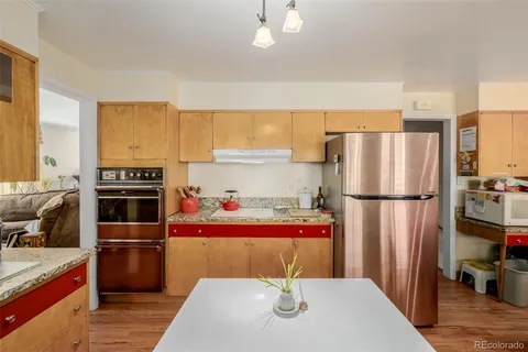 a kitchen with stainless steel appliances a refrigerator and a stove