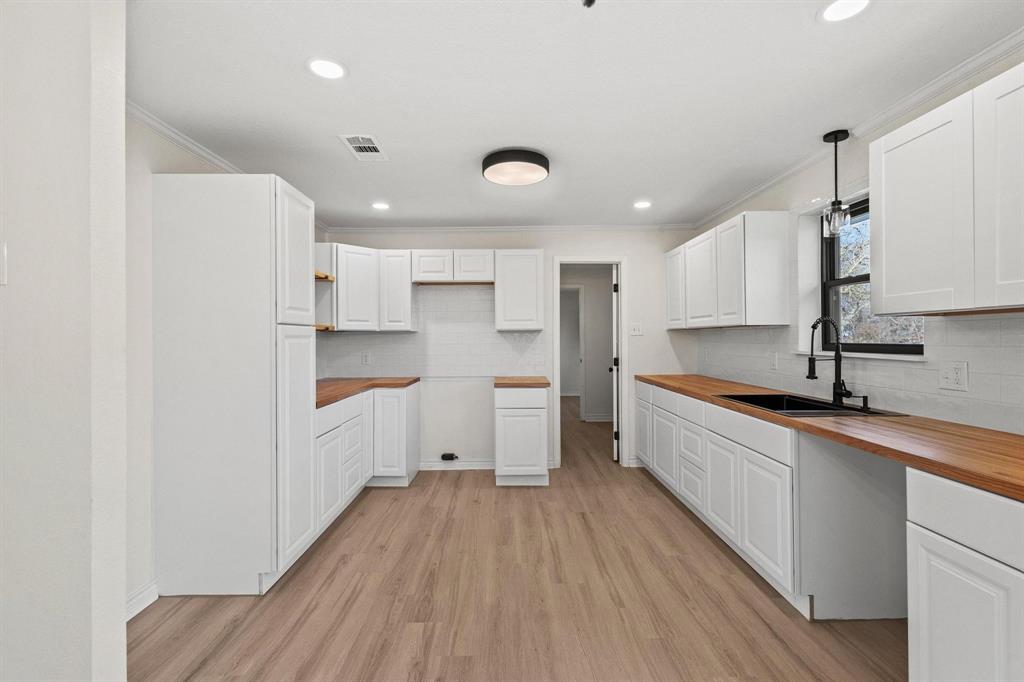 2760 Fm 1897 Bells, TX 75414 - Photo 12 of 34 a large kitchen with a lot of counter space and wooden floor