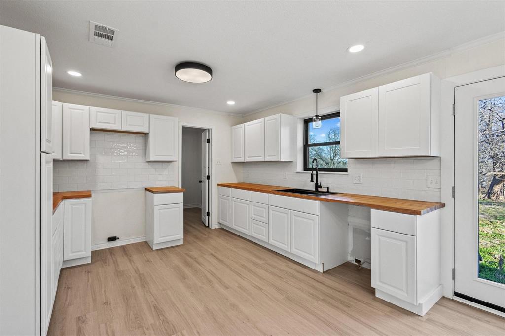 2760 Fm 1897 Bells, TX 75414 - Photo 13 of 34 a large white kitchen with sink and refrigerator