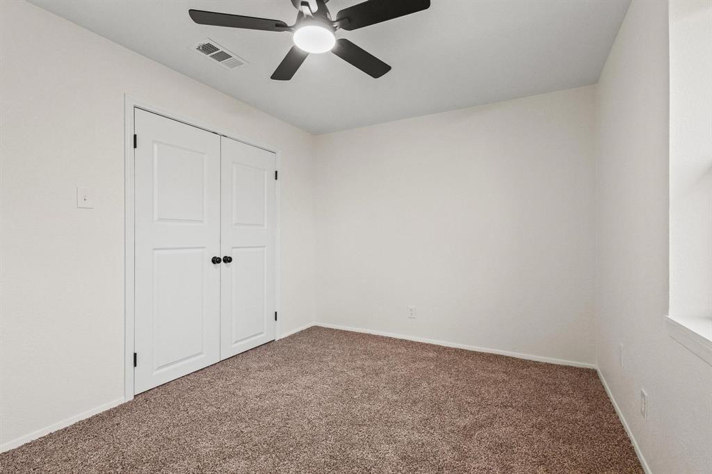 2760 Fm 1897 Bells, TX 75414 - Photo 23 of 34 an empty room with a window and a fan