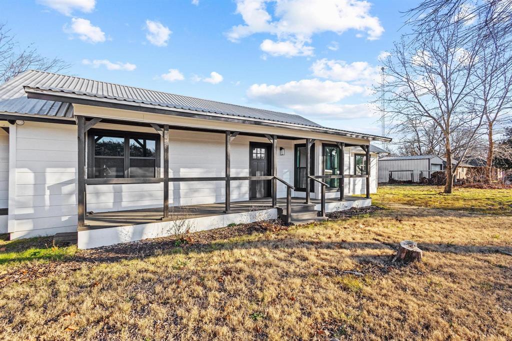 2760 Fm 1897 Bells, TX 75414 - Photo 3 of 34 a view of a house with a large window and yard
