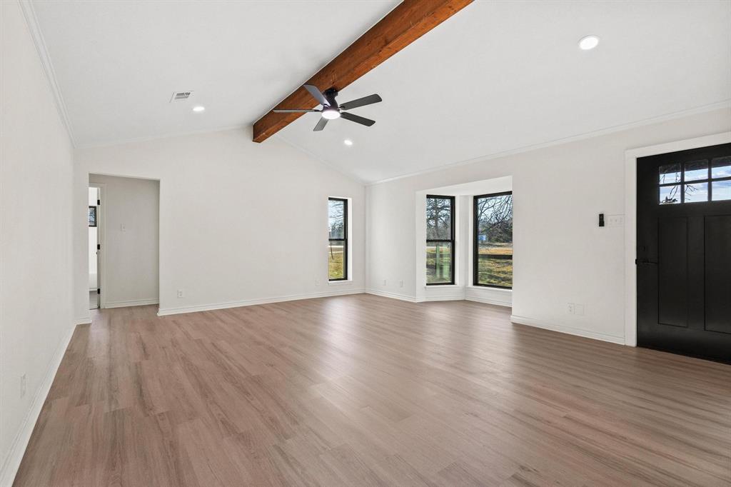 2760 Fm 1897 Bells, TX 75414 - Photo 4 of 34 a view of an empty room with wooden floor and a window