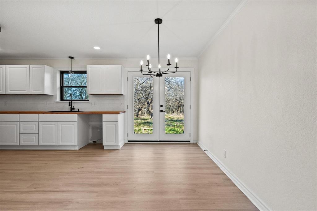2760 Fm 1897 Bells, TX 75414 - Photo 8 of 34 a view of a kitchen with dishwasher and wooden floor