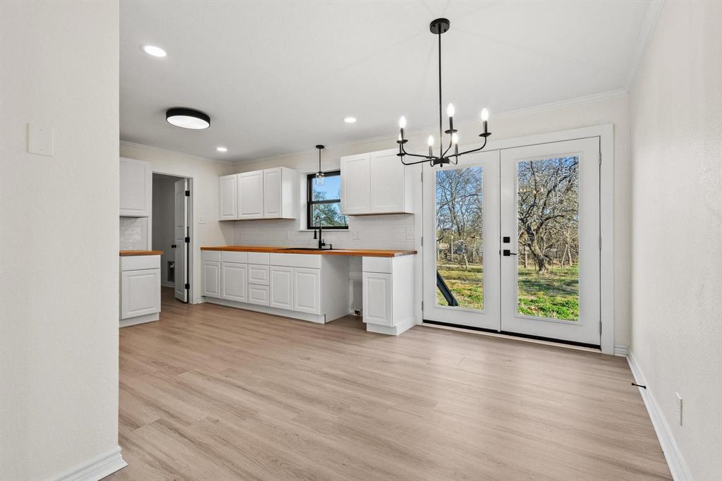 2760 Fm 1897 Bells, TX 75414 - Photo 10 of 34 a open kitchen with a refrigerator a oven and a wooden floor