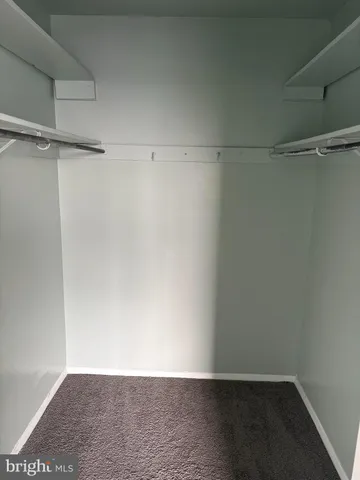 a kitchen with granite countertop a stove and cabinets