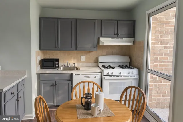 a white refrigerator freezer sitting in a kitchen