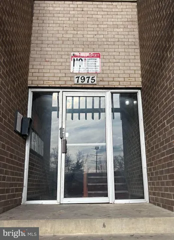 a view of a brick building with a door