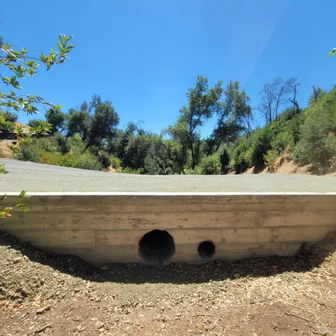 a view of a road with a building in the background