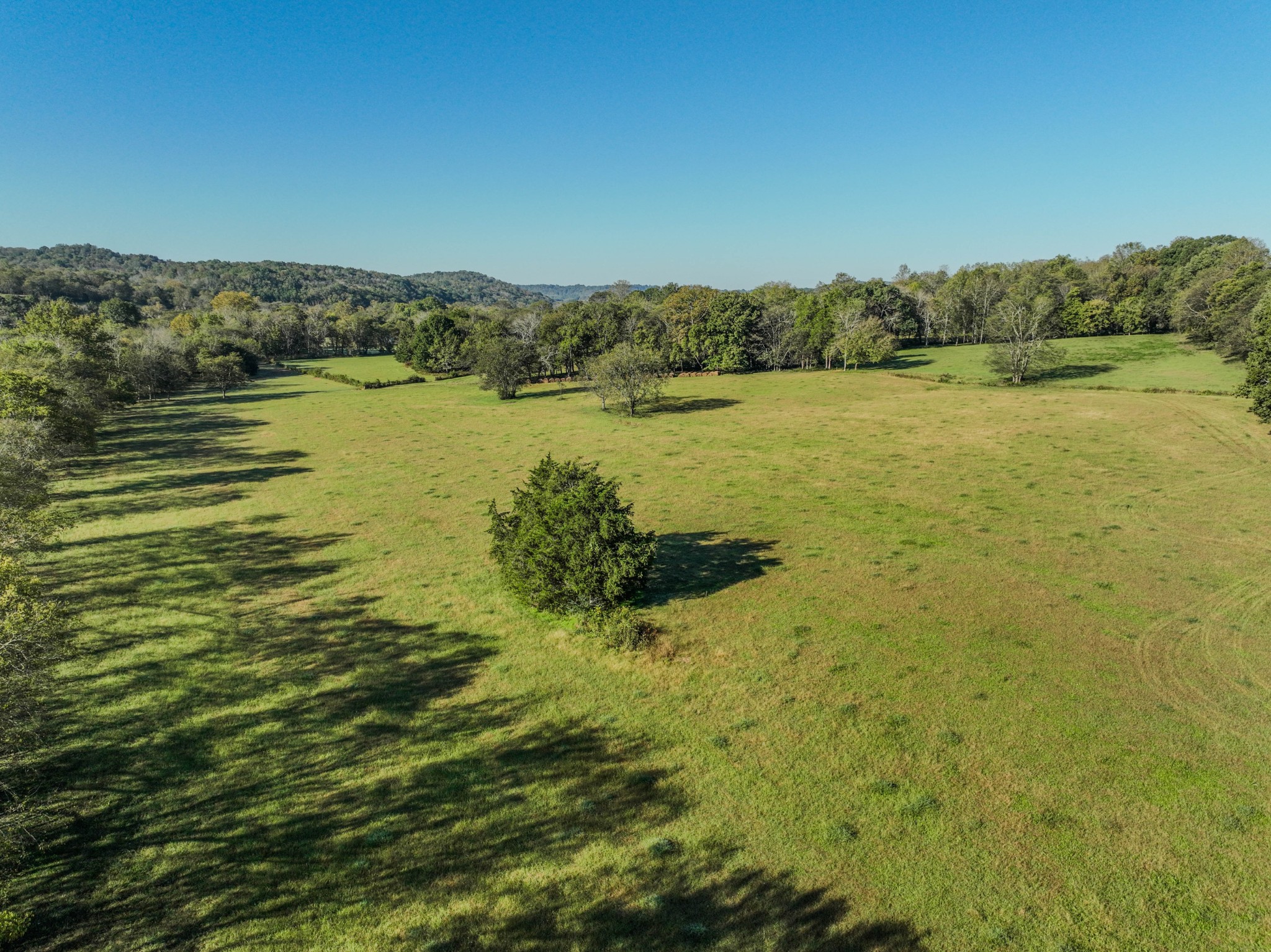 0 Delina Boonshill Road Petersburg, TN 37144 - Photo 7 of 40 a view of a lake with houses in the back