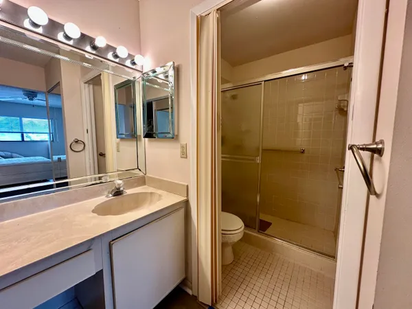 a view of a lake with houses in the back