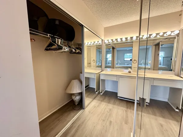 a view of a lake with houses in the back