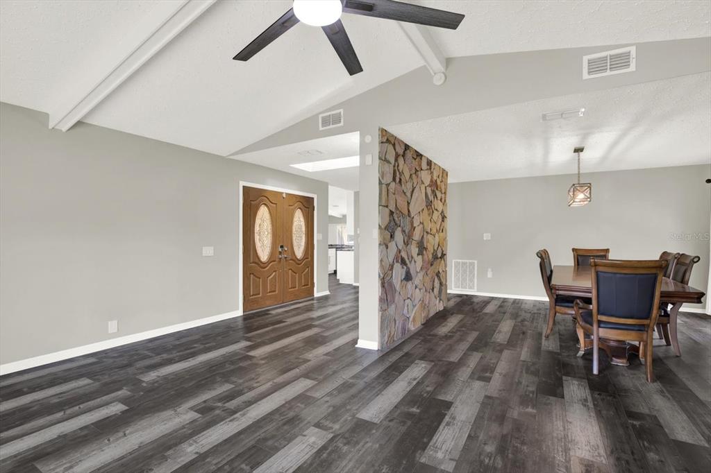 7487 River Country Drive Weeki Wachee, FL 34607 - Photo 12 of 53 a view of a livingroom with furniture and wooden floor