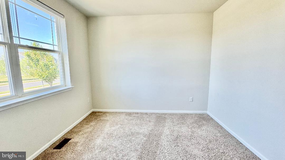 1236 Pimpernell Path Middletown, DE 19709 - Photo 9 of 37 a view of a room that has a window in it