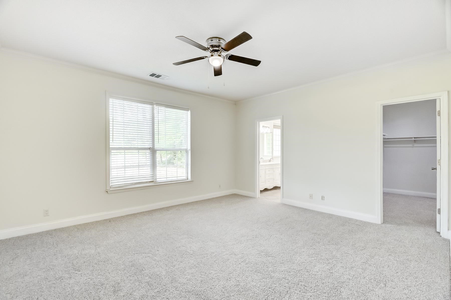 16741 Highway 69 Warren, TX 77664 - Photo 11 of 24 a view of an empty room with a window