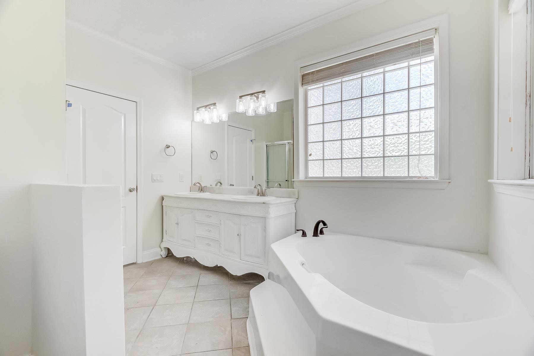 16741 Highway 69 Warren, TX 77664 - Photo 13 of 24 a bathroom with a bathtub and a sink