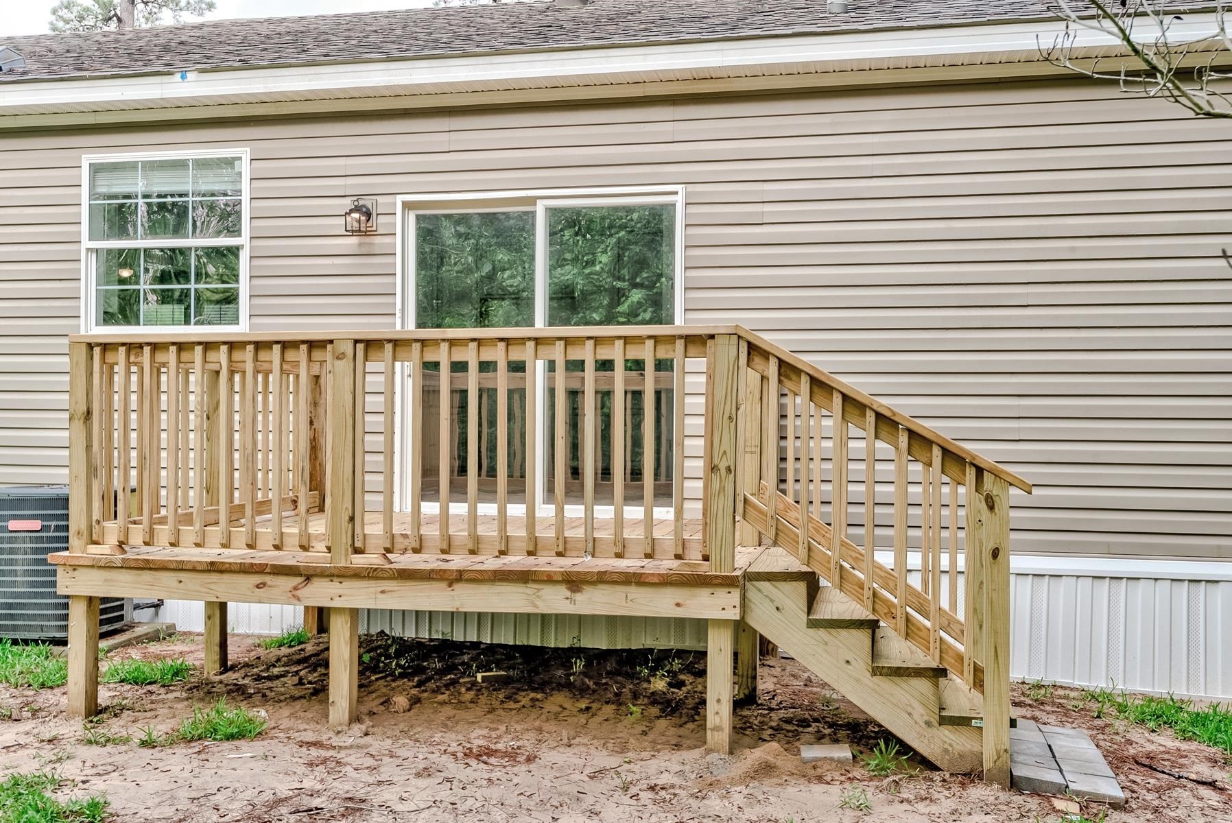 16741 Highway 69 Warren, TX 77664 - Photo 20 of 24 a porch with a bench next to a window