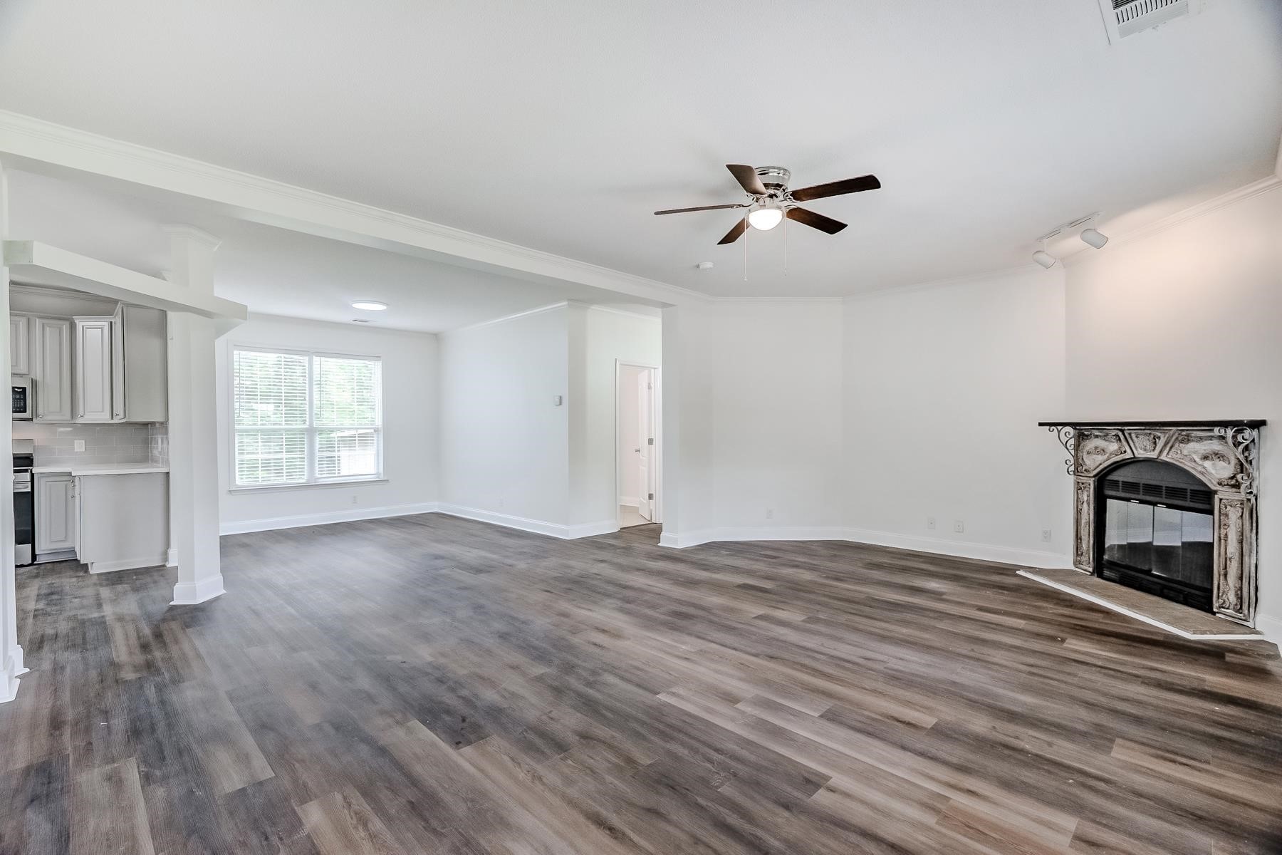 16741 Highway 69 Warren, TX 77664 - Photo 2 of 24 wooden floor in an empty room with a window