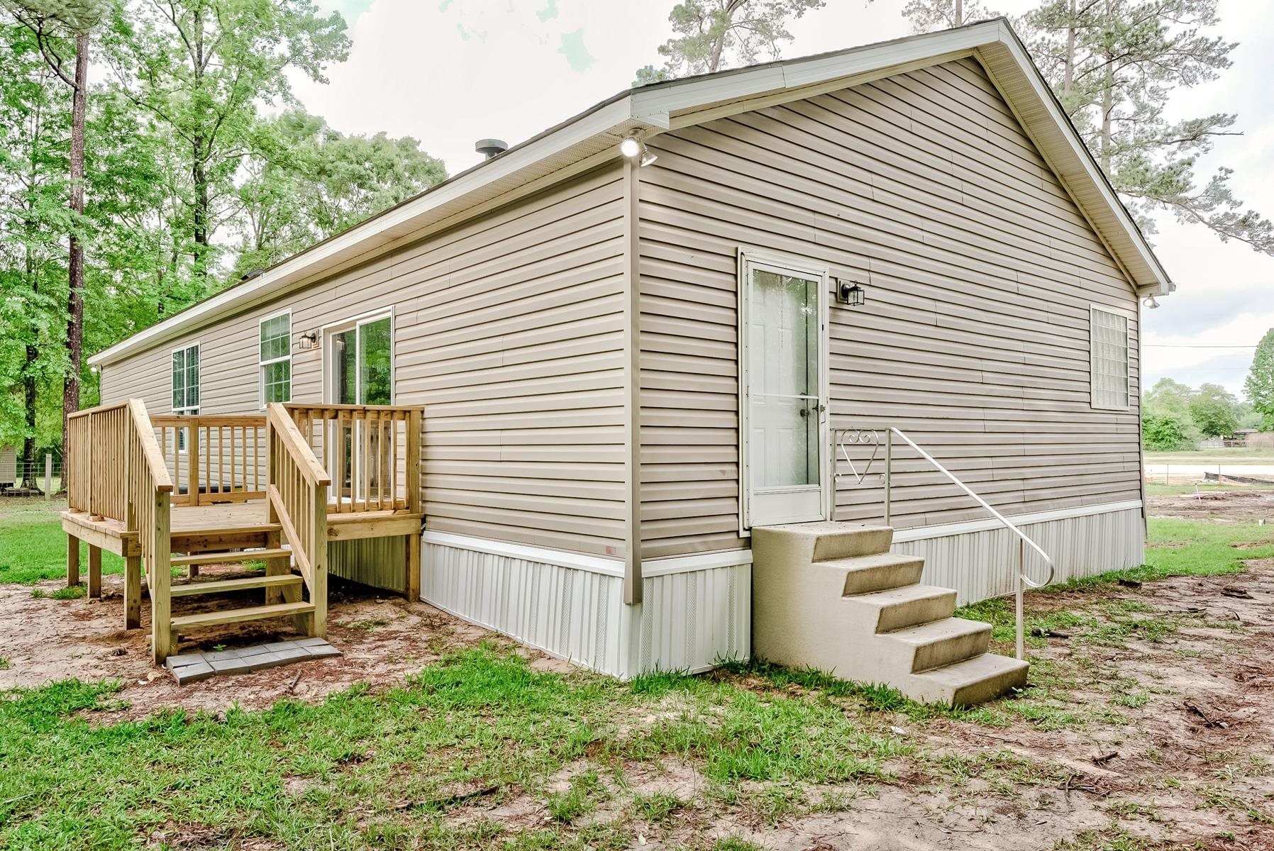 16741 Highway 69 Warren, TX 77664 - Photo 21 of 24 a view of a house with backyard and wooden fence