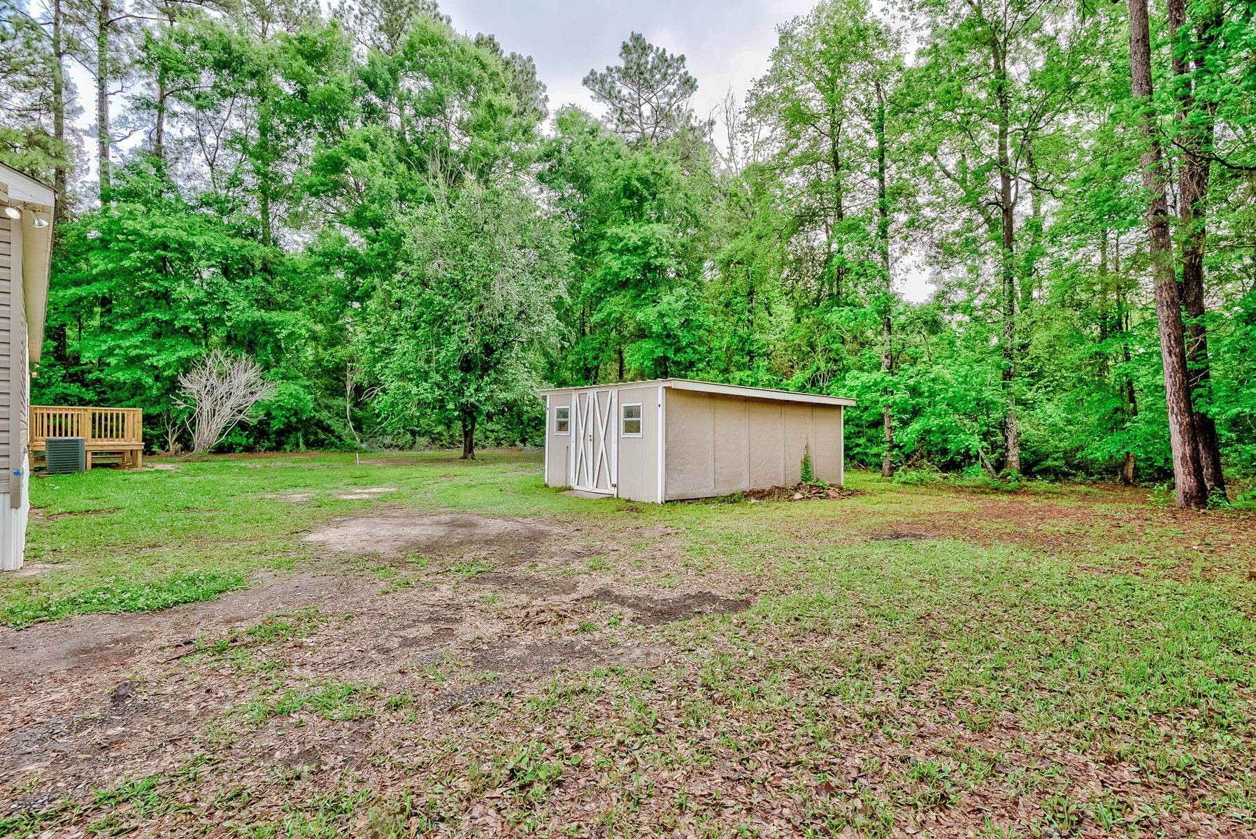 16741 Highway 69 Warren, TX 77664 - Photo 24 of 24 a house with lots of trees