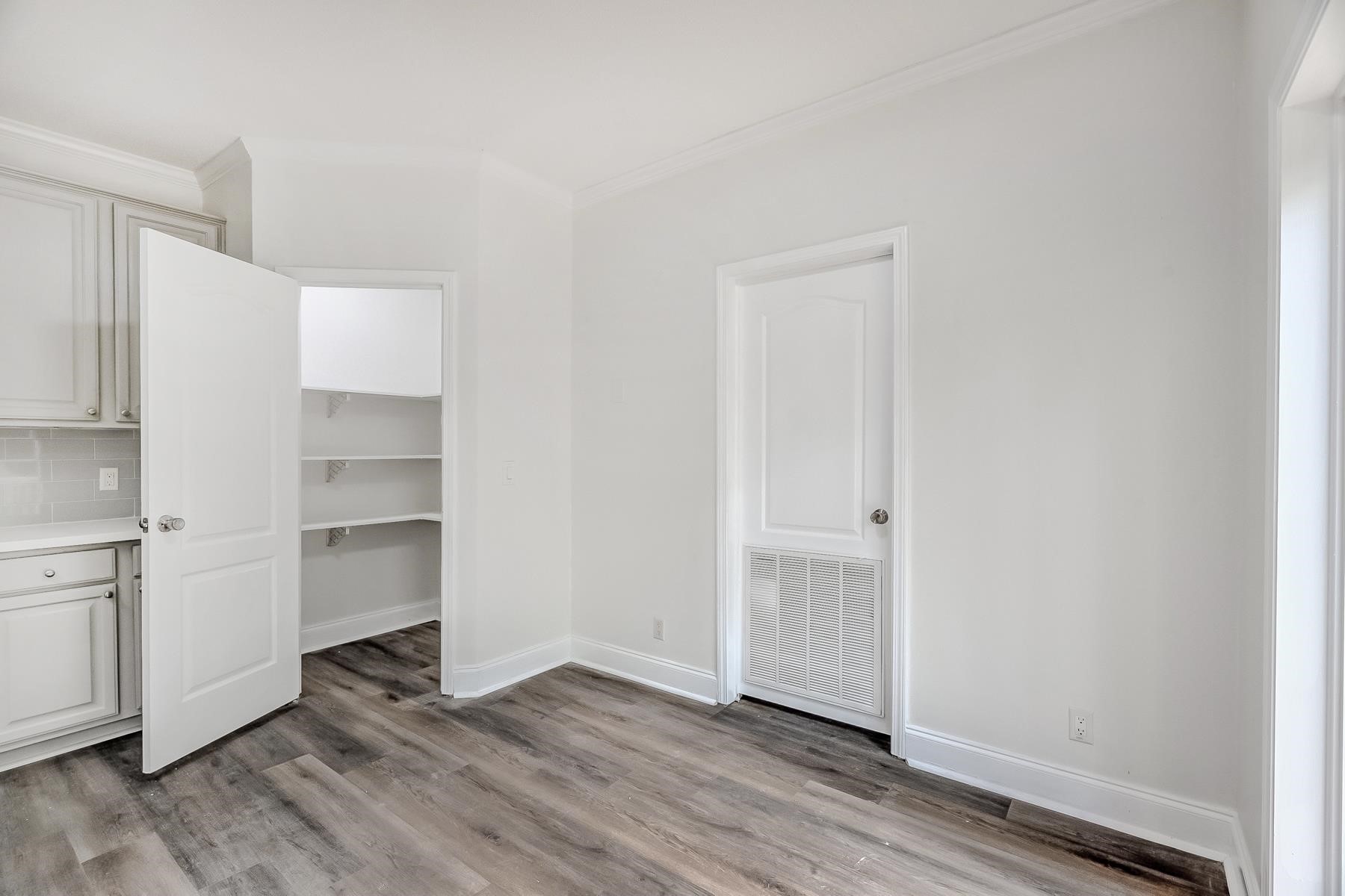 16741 Highway 69 Warren, TX 77664 - Photo 10 of 24 a view of empty room with wooden floor and cabinet
