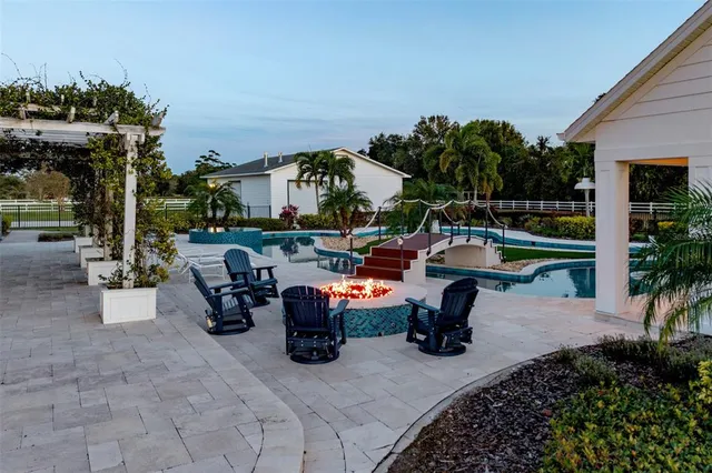 a living room with furniture a large window and a flat screen tv