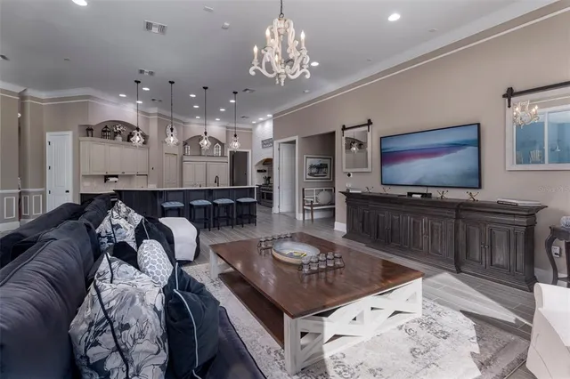 a living room with furniture and a piano