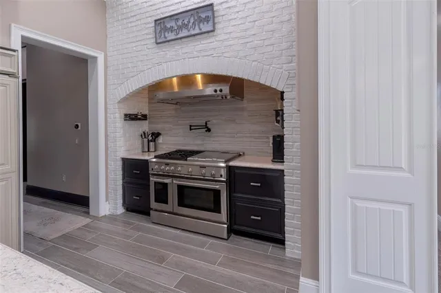 a view of a house with swimming pool and a yard