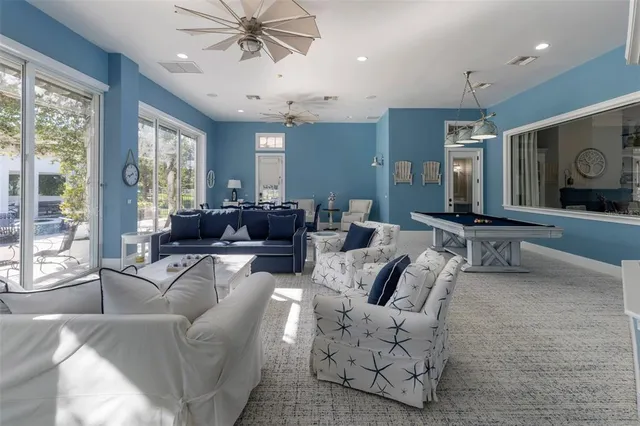 an aerial view of a house with garden space and lake view