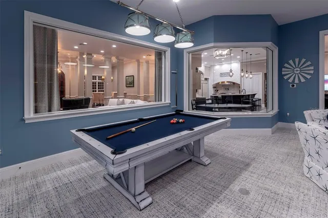 a view of a house with swimming pool and a yard