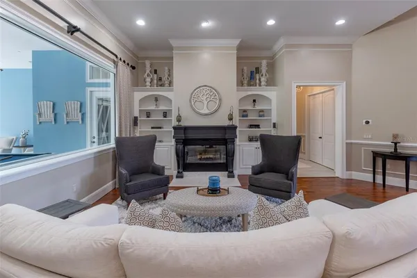 a view of a swimming pool with sitting area and furniture