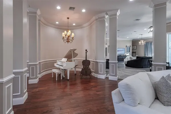 a view of a swimming pool with outdoor seating