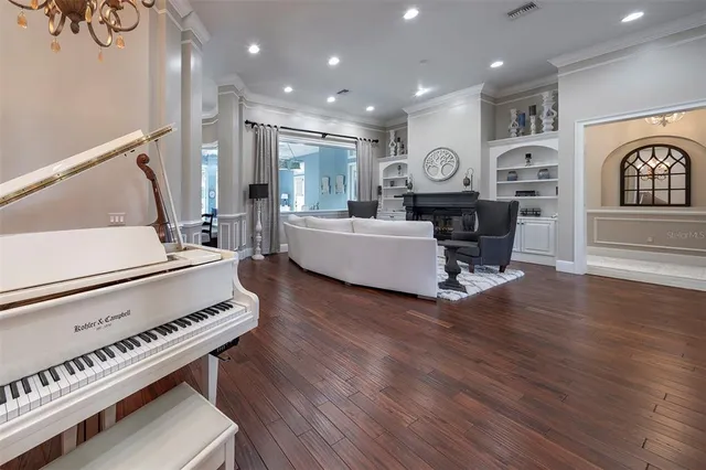 a view of a patio with table and chairs and potted plants