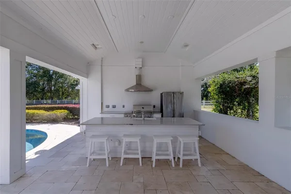 an aerial view of a house with garden space and street view