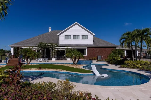 an aerial view of a house with outdoor space