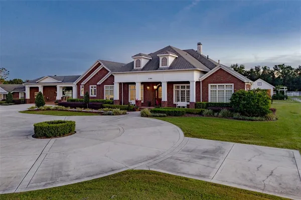 an aerial view of a house with garden space and street view