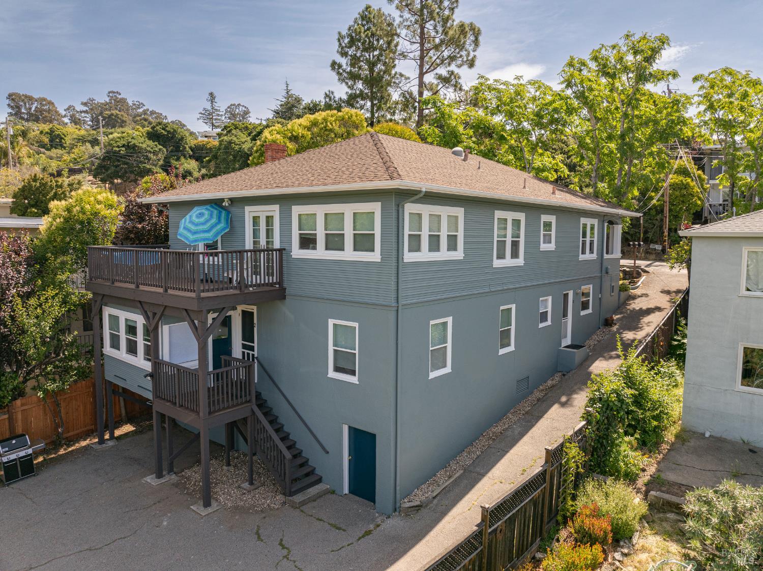 31 Valencia Avenue San Rafael, CA 94901 - Photo 2 of 28 The top unit has a deck with French doors. The middle unit has a sunroom. The lower unit is located on the right side of the building near the driveway.