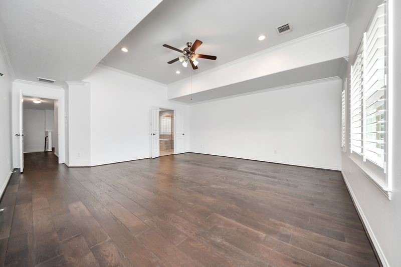 4222 Drake Street Houston, TX 77005 - Photo 17 of 28 wooden floor in an empty room with a window
