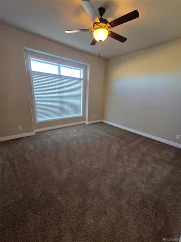 a large kitchen with a table and chairs in it