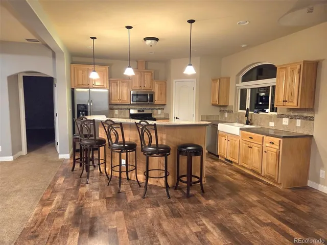 a view of a house with a backyard