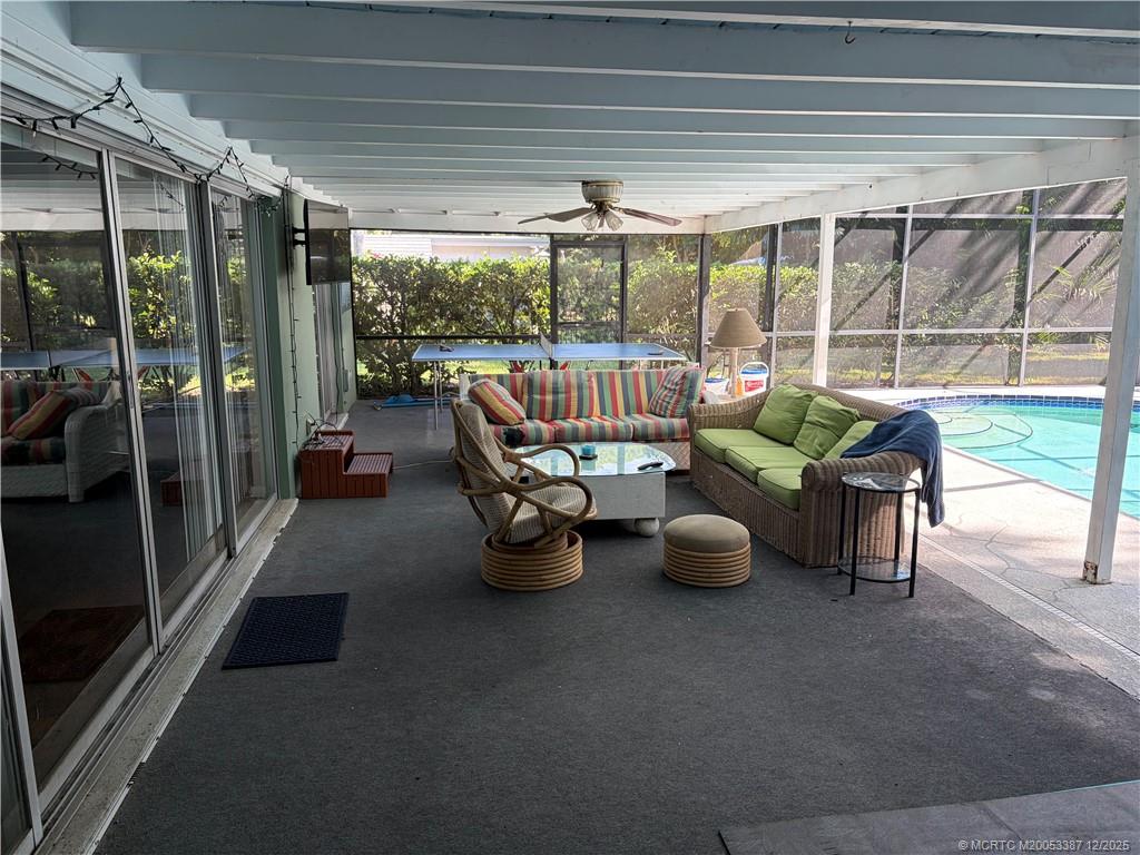 1346 Northwest Pine Ridge Trail Stuart, FL 34994 - Photo 13 of 21 a room with furniture and a potted plant