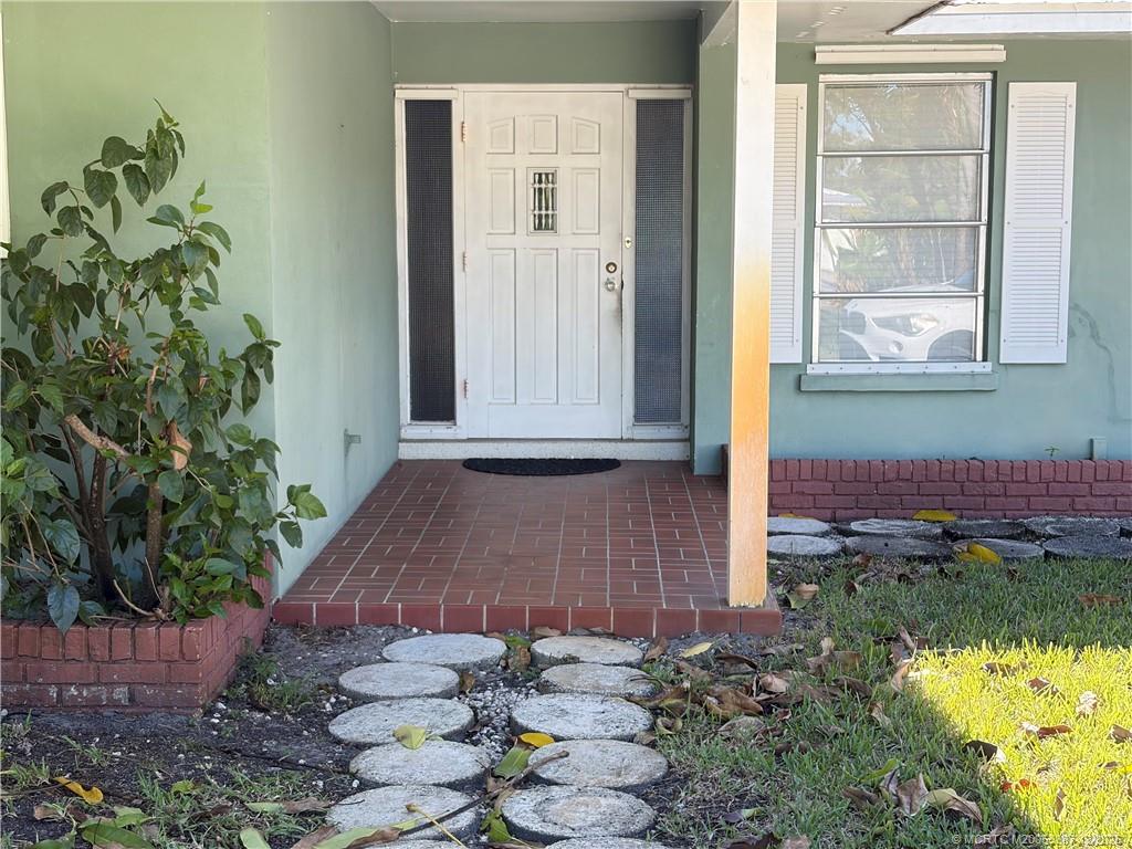 1346 Northwest Pine Ridge Trail Stuart, FL 34994 - Photo 2 of 21 a view of front door of house