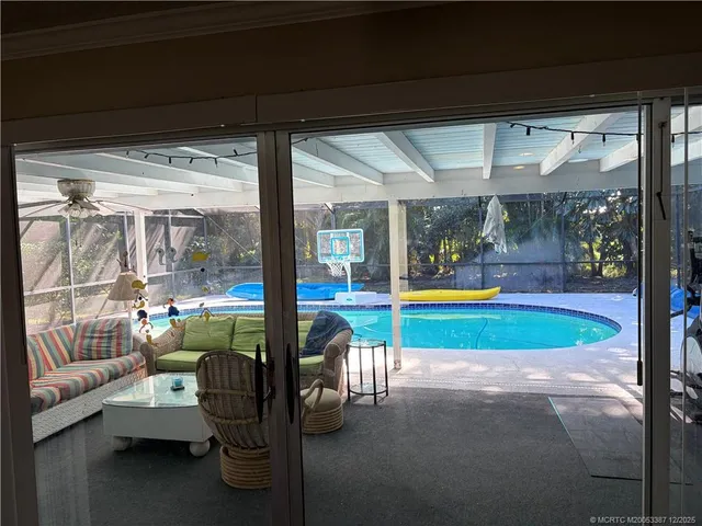 a view of swimming pool with outdoor seating
