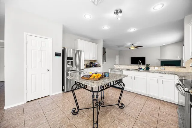 a white toilet sitting next to a white wall