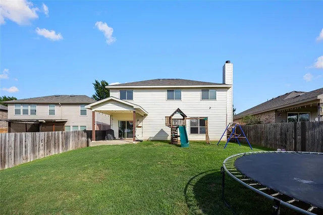 a room with a cabinets and a painting on the wall