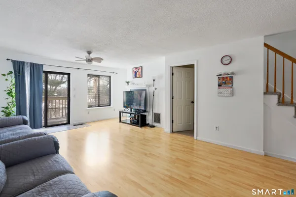 a view of a livingroom with furniture and windows