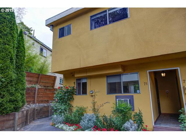 839 Southwest Broadway Drive, Unit 71 Portland, OR 97201 - Photo 1 of 15 a front view of a house with a yard