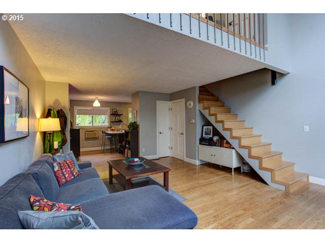 839 Southwest Broadway Drive, Unit 71 Portland, OR 97201 - Photo 4 of 15 a living room with furniture and wooden floor