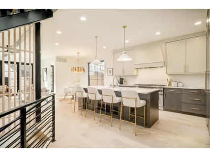 a large kitchen with lots of counter space and windows